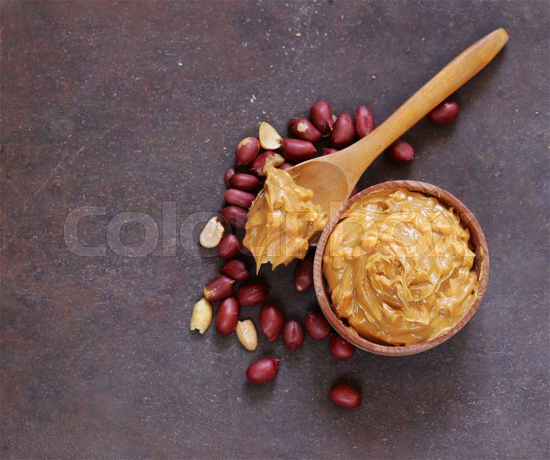 Natural peanut butter with fresh nuts, stock photo