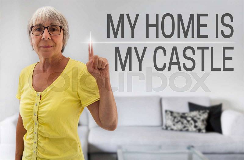 My home is my castle touchscreen is shown by senior, stock photo