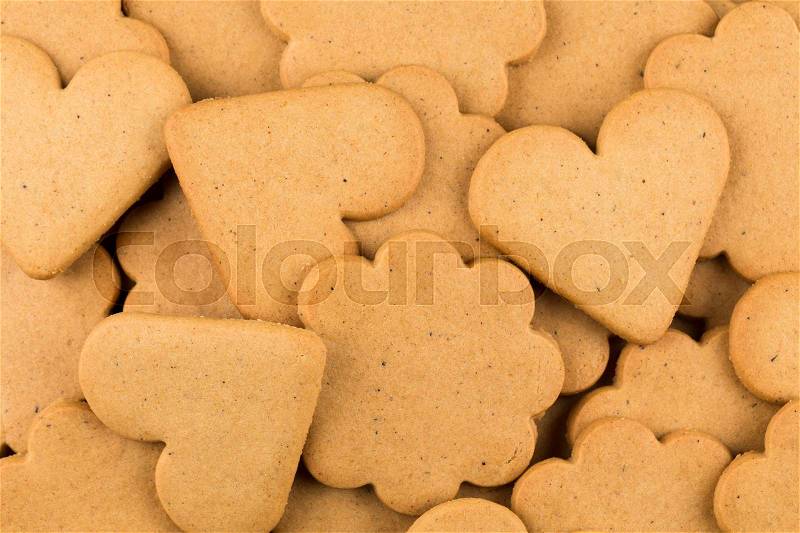Gingerbread hearts cookies as a background. Christmas decoration, stock photo
