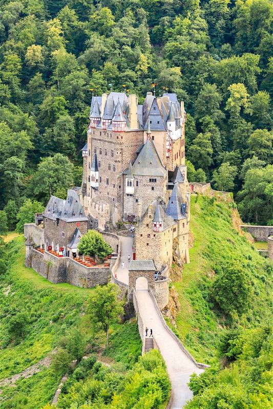 Eltz Castle, a medieval castle located on a hill in the forest, stock photo
