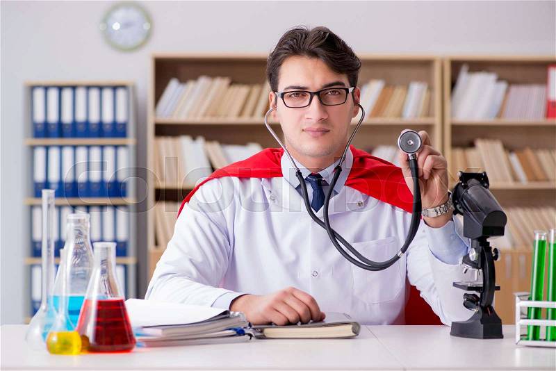 Superhero doctor working in the lab hospital, stock photo
