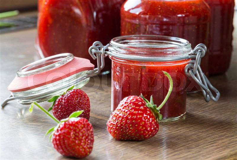 Strawberry jam cooking finished jam in jars, stock photo