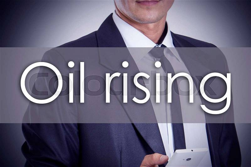 Oil rising - Young businessman with text - business concept - horizontal image, stock photo