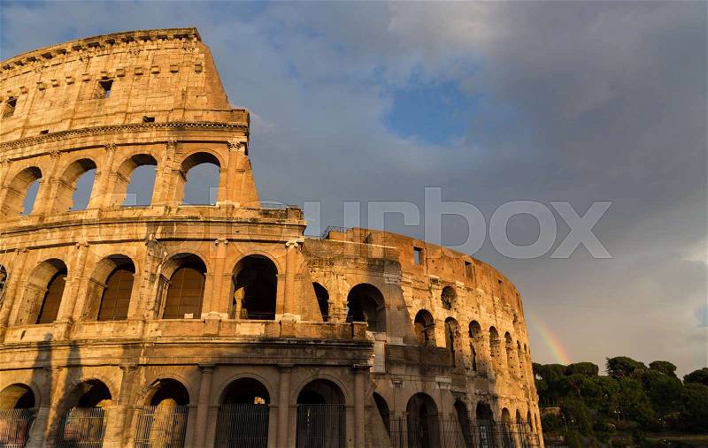 Colosseum in Rome by day with rainbow, stock photo