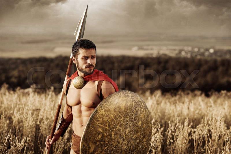 Young and fearless. Sepia shot of a young brave Spartan warrior standing alone in a field copyspace legionnaire gladiator bravery sportive athletic muscles strong perfection medieval concept, stock photo