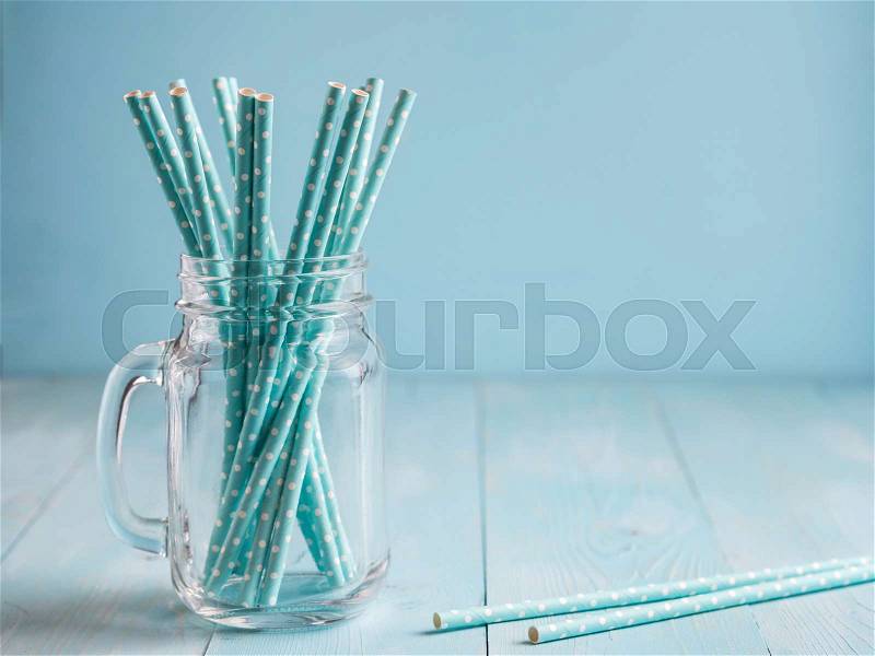 Mason jars with yellow paper straws and cap. Ideal for summer drinks and smoothies, stock photo