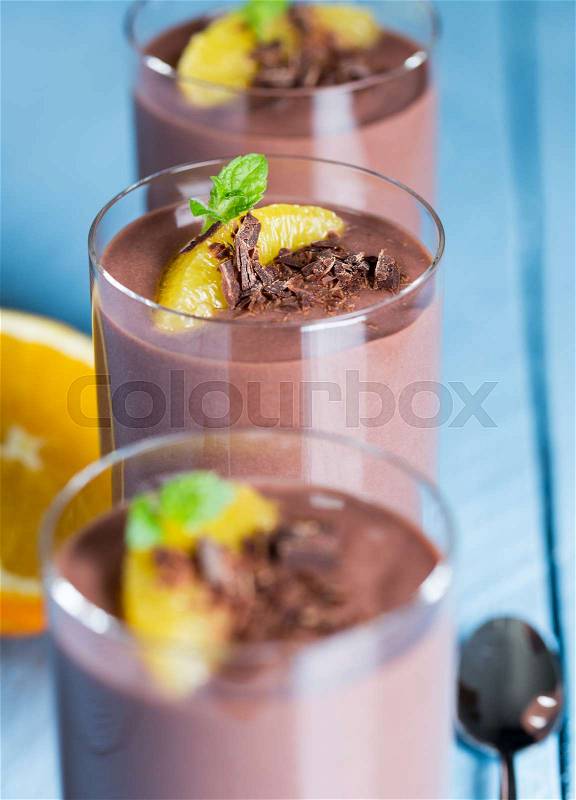 Chocolate pudding dessert with orange and pistachio, stock photo