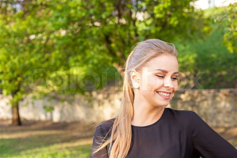 Blond in stylish black blouse, business style. Outside smtrit distance. free space for your text, stock photo