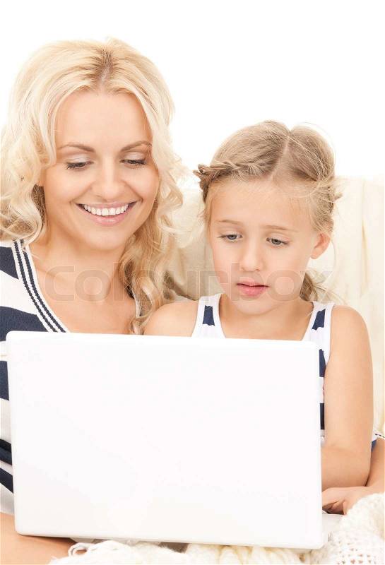 Bright picture of happy mother and child with laptop computer, stock photo