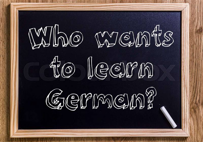 Who wants to learn German? - New chalkboard with 3D outlined text - on wood, stock photo