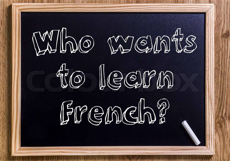Who wants to learn French? - New chalkboard with 3D outlined text - on wood, stock photo