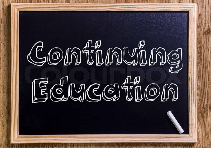 Continuing Education - New chalkboard with outlined text - on wood, stock photo