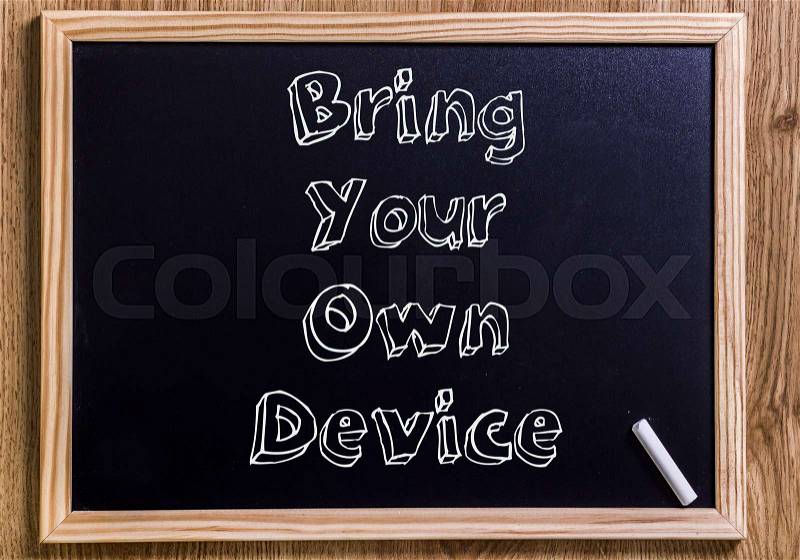 Bring Your Own Device BYOD - New chalkboard with outlined text - on wood, stock photo