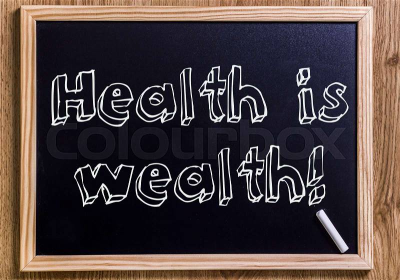 Health is wealth! - New chalkboard with outlined text - on wood, stock photo