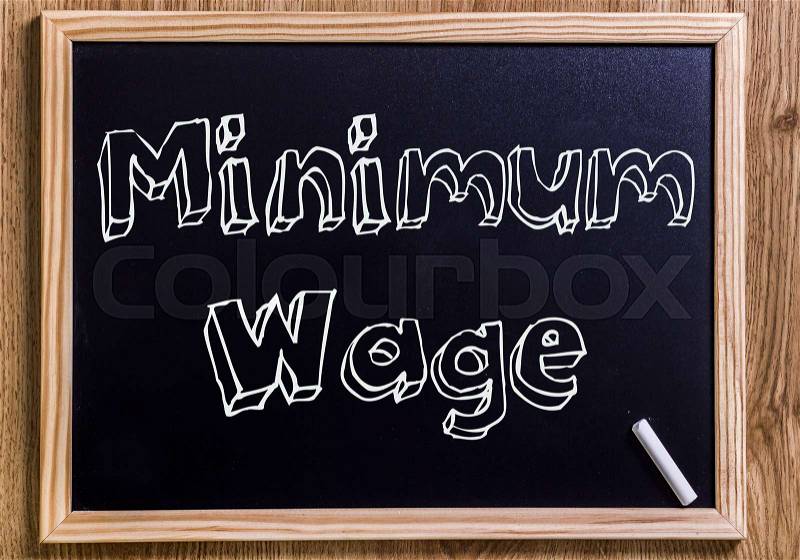 Minimum Wage - New chalkboard with outlined text - on wood, stock photo