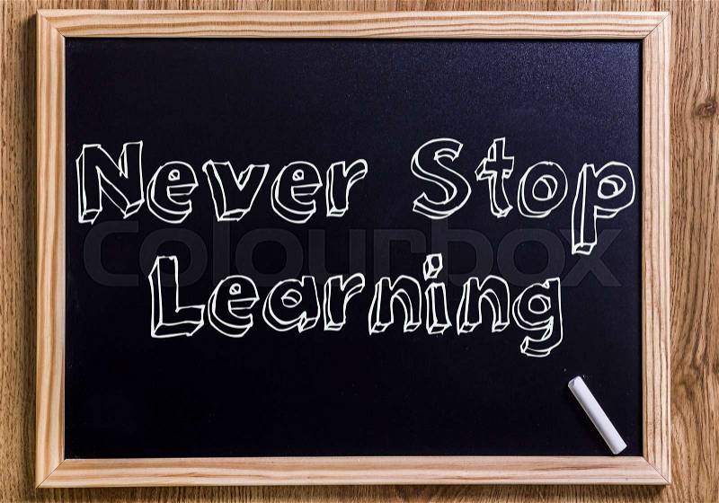 NEVER Stop Learning - New chalkboard with outlined text - on wood, stock photo