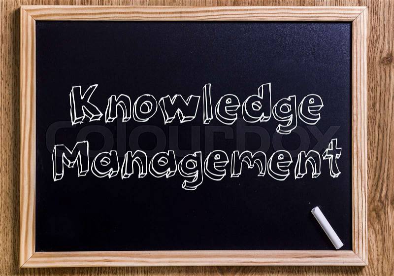 Knowledge Management - New chalkboard with outlined text - on wood, stock photo