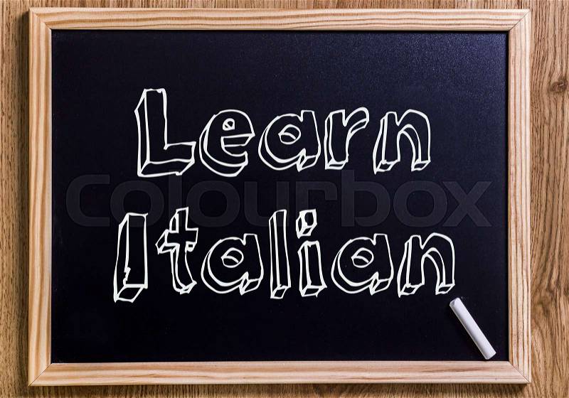 Learn Italian - New chalkboard with outlined text - on wood, stock photo
