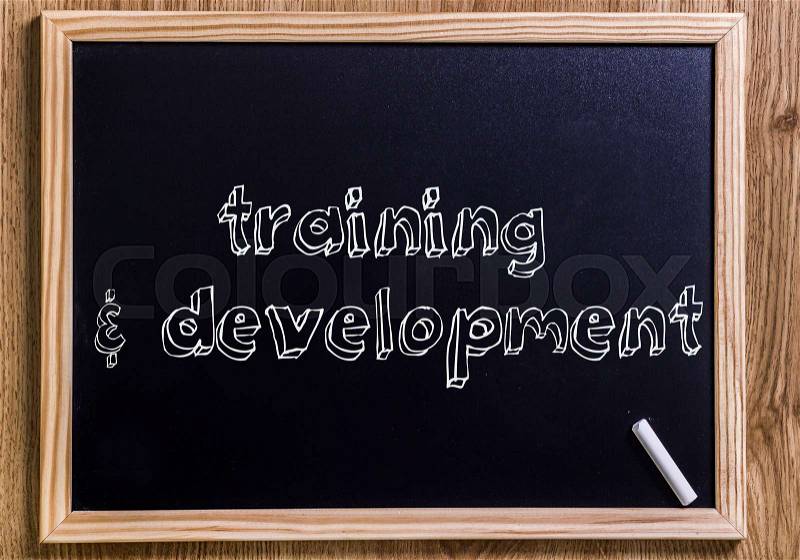 Training & development - New chalkboard with 3D outlined text - on wood, stock photo