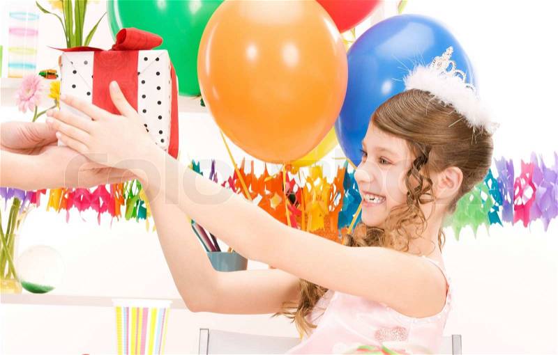 Happy party girl with balloons and gift box, stock photo