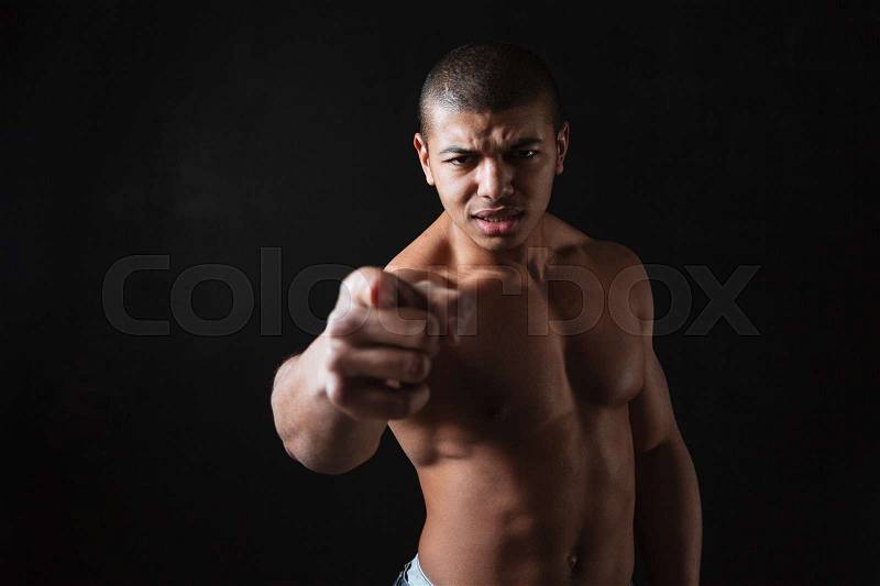 Angry shirtless african american man athlete pointing on you, stock photo