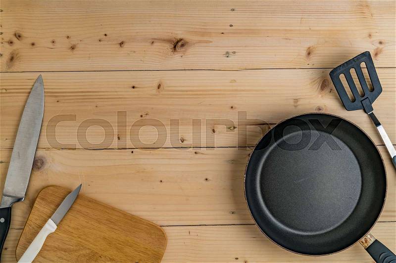 Top view of Kitchen ware utensils on wooden desk, stock photo
