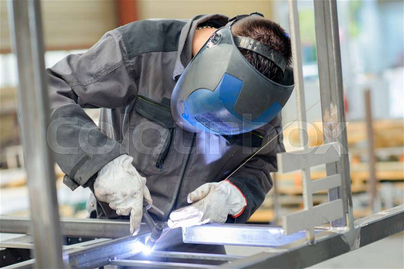 Welder with blow torch, stock photo