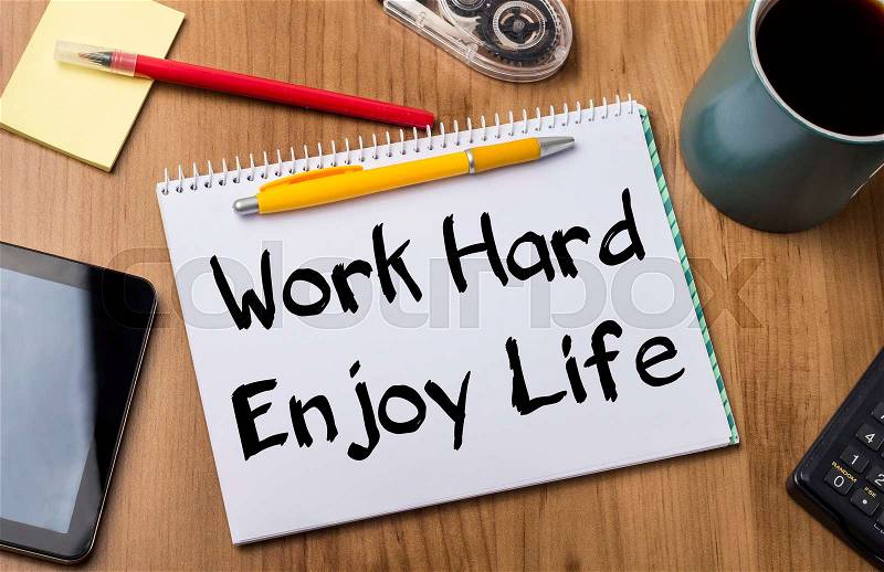 Work Hard Enjoy Life - Note Pad With Text On Wooden Table - with office tools, stock photo