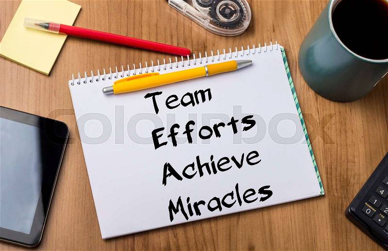Team Efforts Achieve Miracles - Note Pad With Text On Wooden Table - with office tools, stock photo