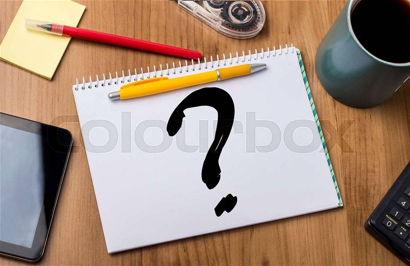 Question mark - Note Pad With Text On Wooden Table - with office tools, stock photo