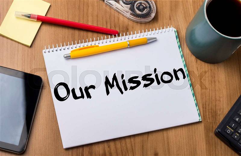 Our Mission - Note Pad With Text On Wooden Table - with office tools, stock photo