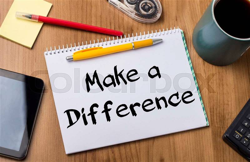 Make a Difference - Note Pad With Text On Wooden Table - with office tools, stock photo