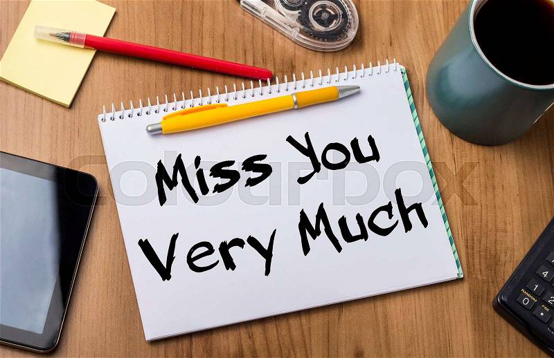 Miss You Very Much - Note Pad With Text On Wooden Table - with office tools, stock photo