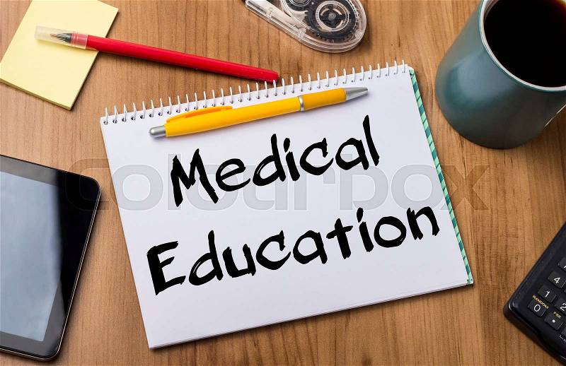 Medical Education - Note Pad With Text On Wooden Table - with office tools, stock photo