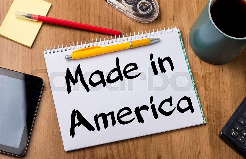 Made in America - Note Pad With Text On Wooden Table - with office tools, stock photo