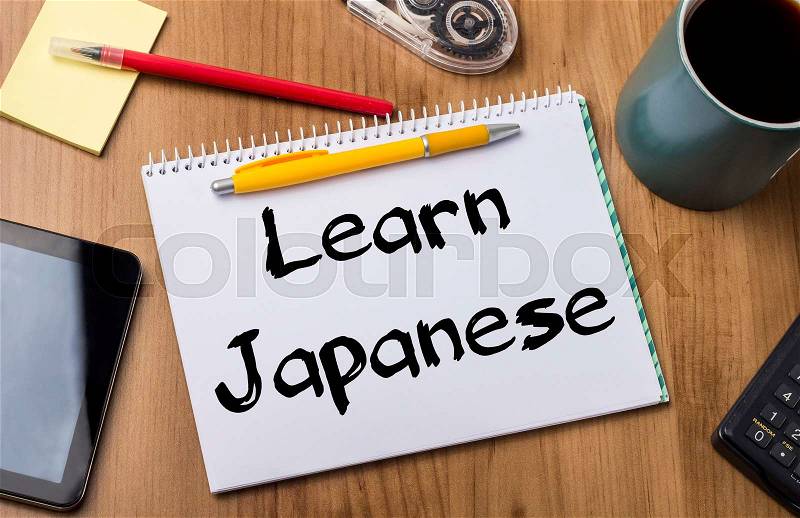 Learn Japanese - Note Pad With Text On Wooden Table - with office tools, stock photo