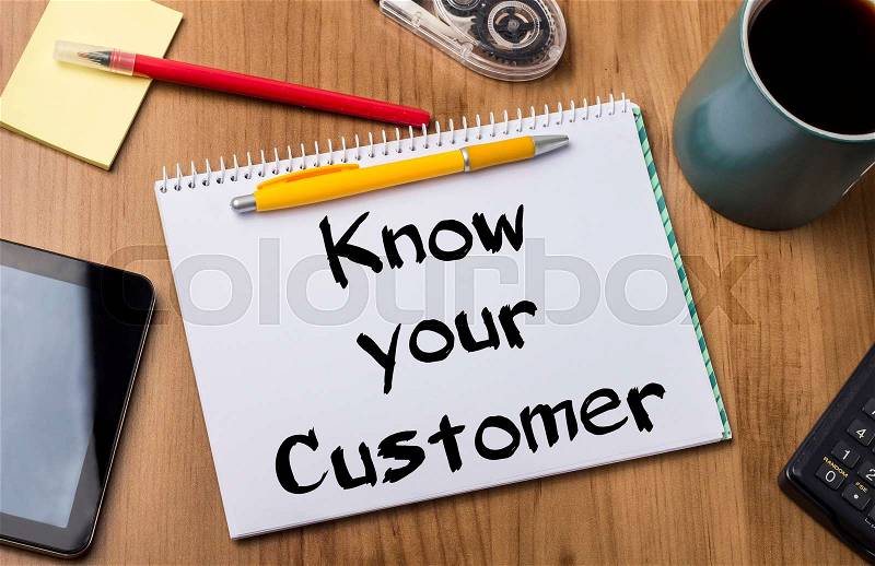 Know your Customer - Note Pad With Text On Wooden Table - with office tools, stock photo