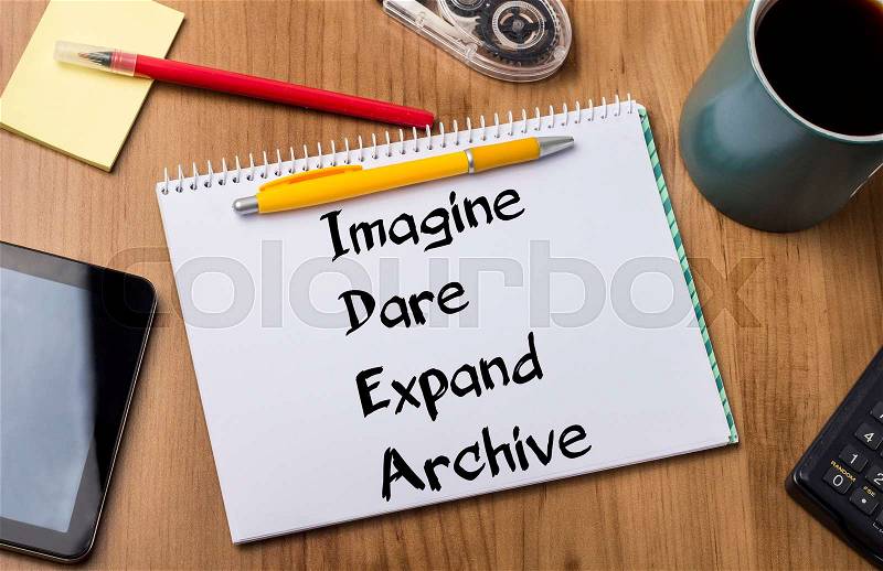 Imagine Dare Expand Archive IDEA - Note Pad With Text On Wooden Table - with office tools, stock photo