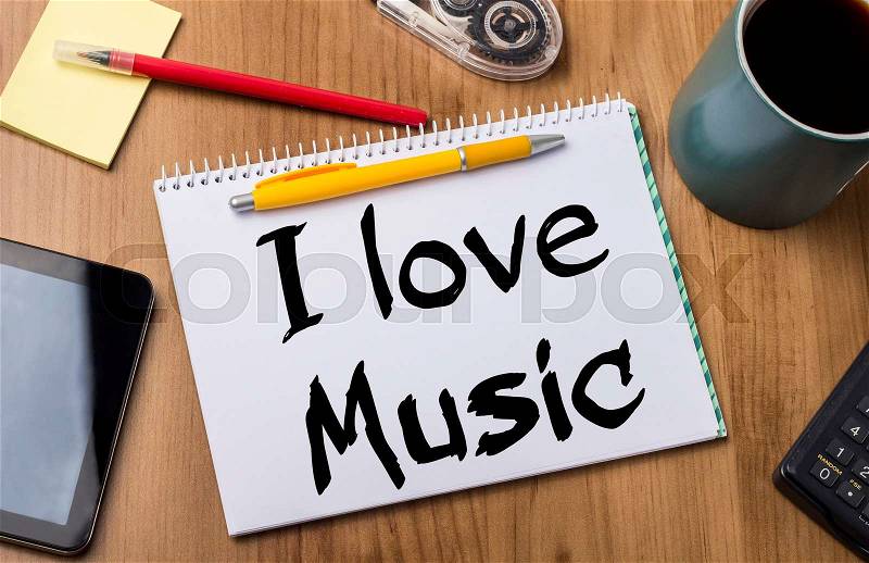 I love Music - Note Pad With Text On Wooden Table - with office tools, stock photo