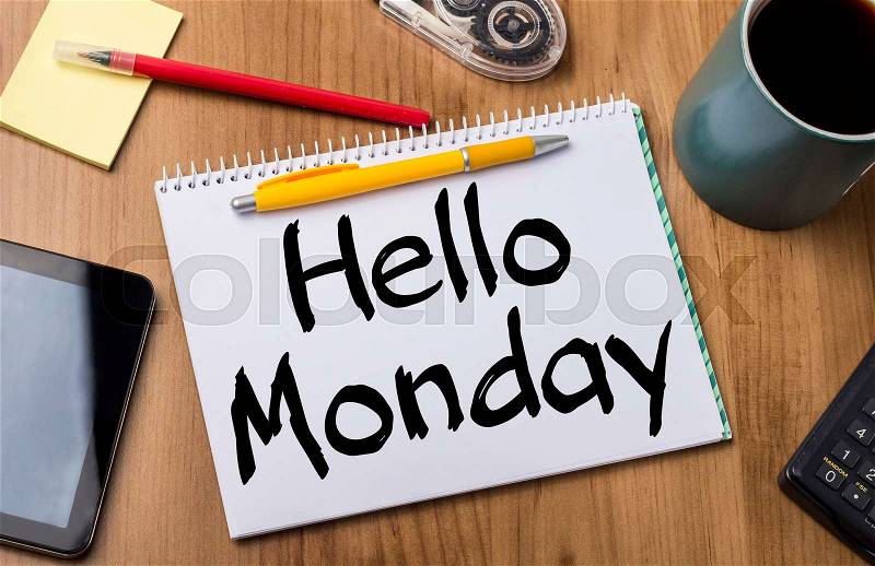 Hello Monday - Note Pad With Text On Wooden Table - with office tools, stock photo
