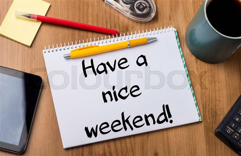 Have a nice weekend! - Note Pad With Text On Wooden Table - with office tools, stock photo