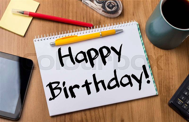 Happy Birthday! - Note Pad With Text On Wooden Table - with office tools, stock photo