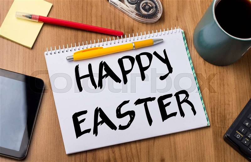 HAPPY EASTER - Note Pad With Text On Wooden Table - with office tools, stock photo
