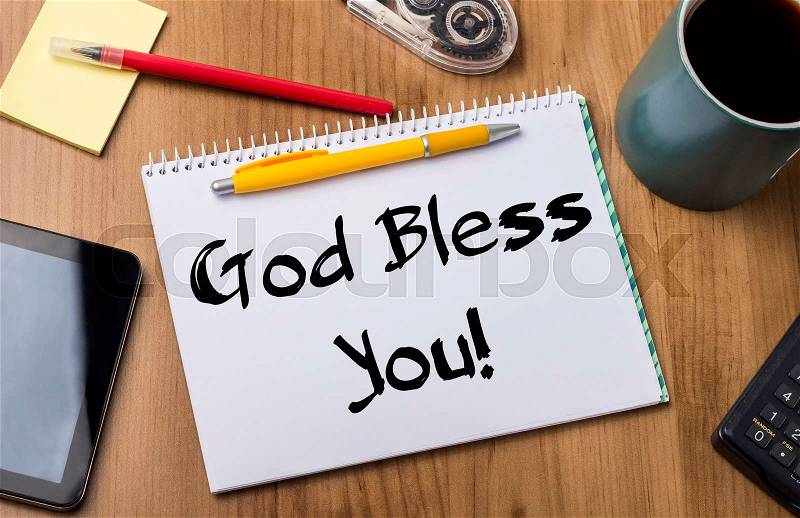 God Bless You! - Note Pad With Text On Wooden Table - with office tools, stock photo