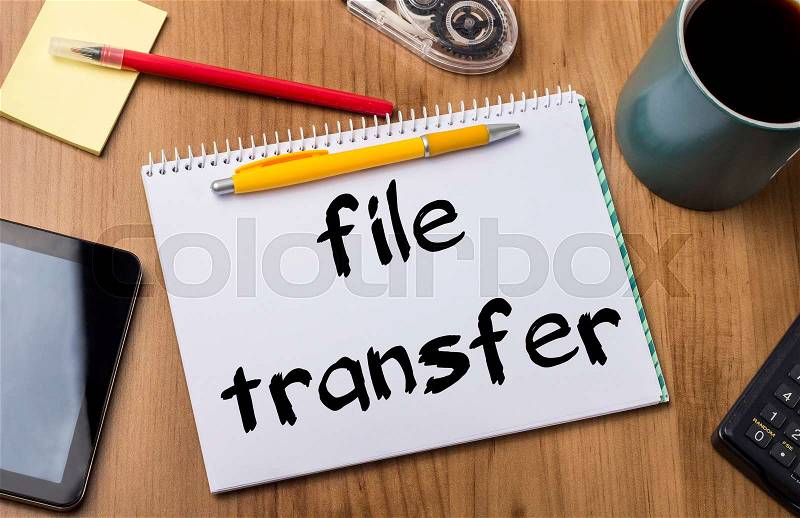 File transfer - Note Pad With Text On Wooden Table - with office tools, stock photo