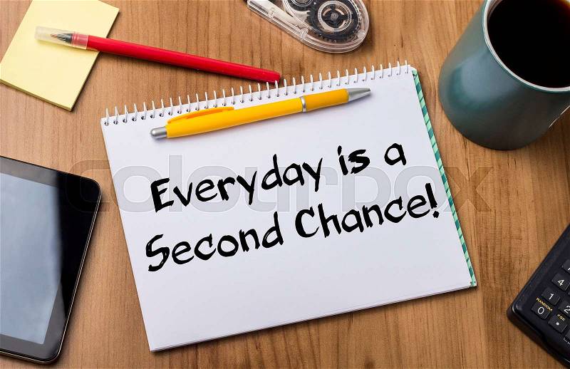 Everyday is a Second Chance! - Note Pad With Text On Wooden Table - with office tools, stock photo