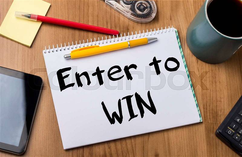 Enter to WIN - Note Pad With Text On Wooden Table - with office tools, stock photo