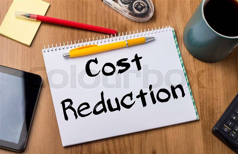 Cost Reduction - Note Pad With Text On Wooden Table - with office tools, stock photo