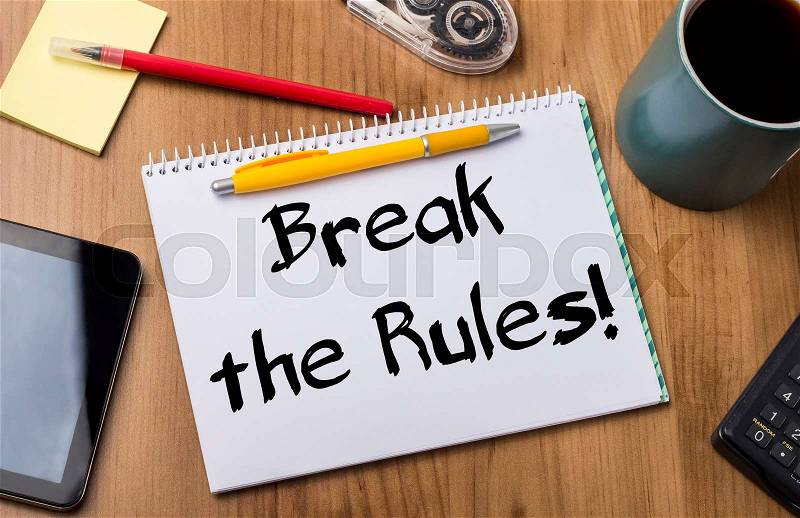 Break the Rules! - Note Pad With Text On Wooden Table - with office tools, stock photo