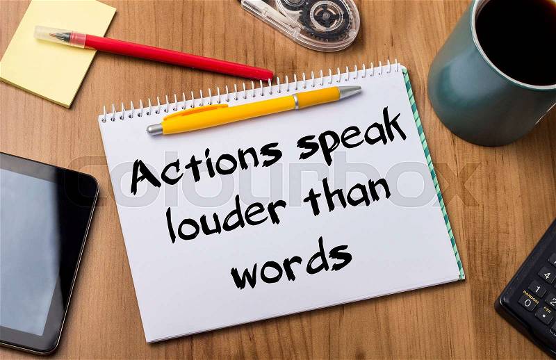 Actions speak louder than words - Note Pad With Text On Wooden Table - with office tools, stock photo